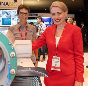 The Hon. Kate Jones MP, checking out Magnetica's compact MRI products with Sara, Product Manager