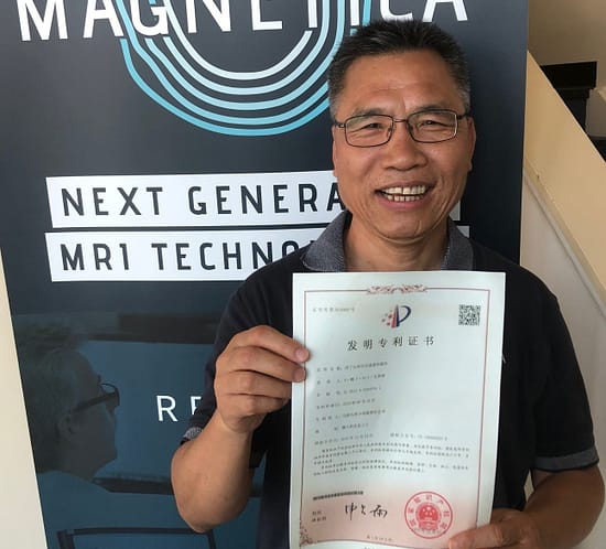 Dr Riyu Wei, one of the inventors, holding the Chinese Certificate for Magnetica's “Magnet for Head and Extremity Imaging” patent - granted in China and Japan.